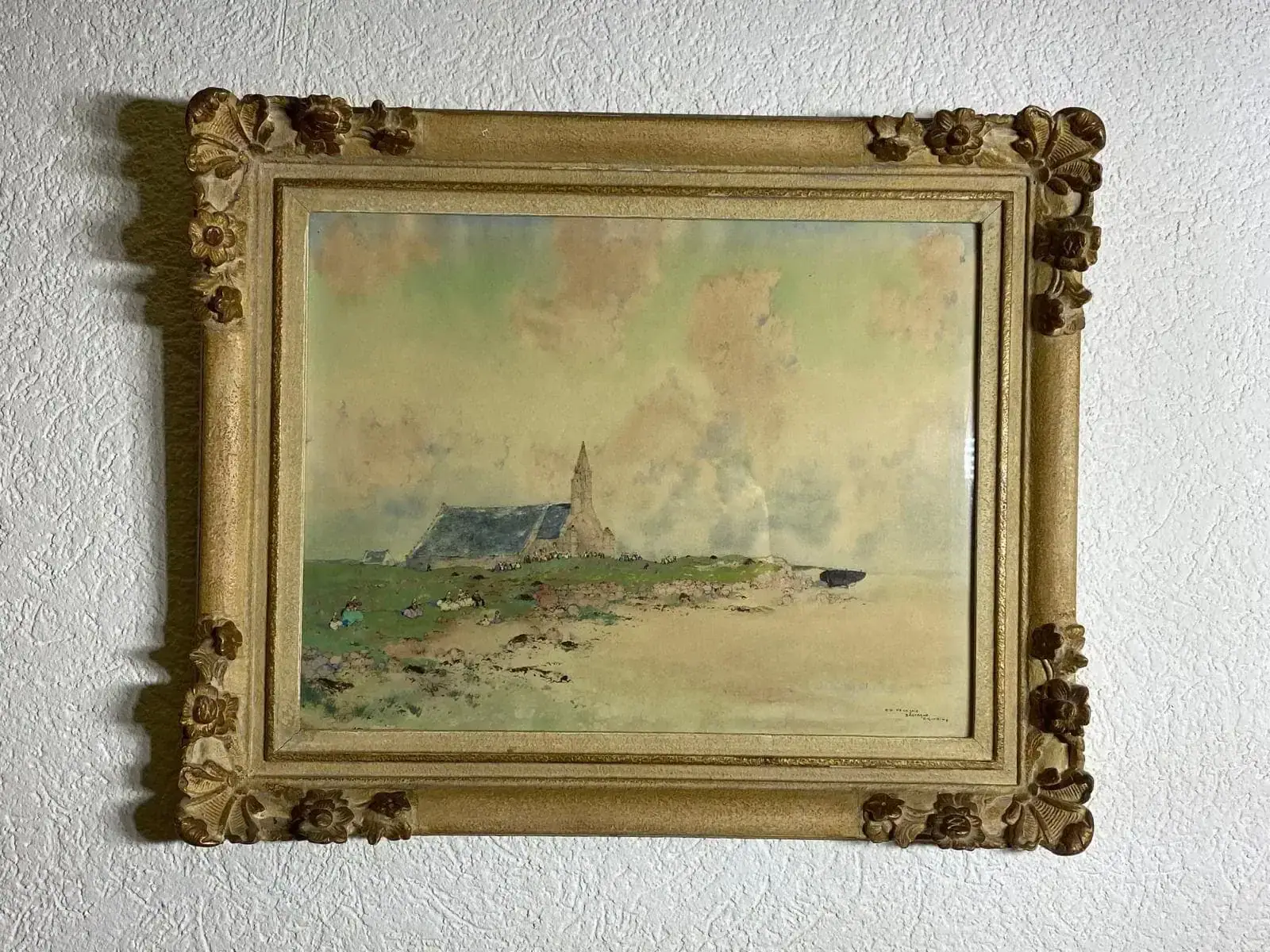 Peinture encadrée d’une église sur une colline