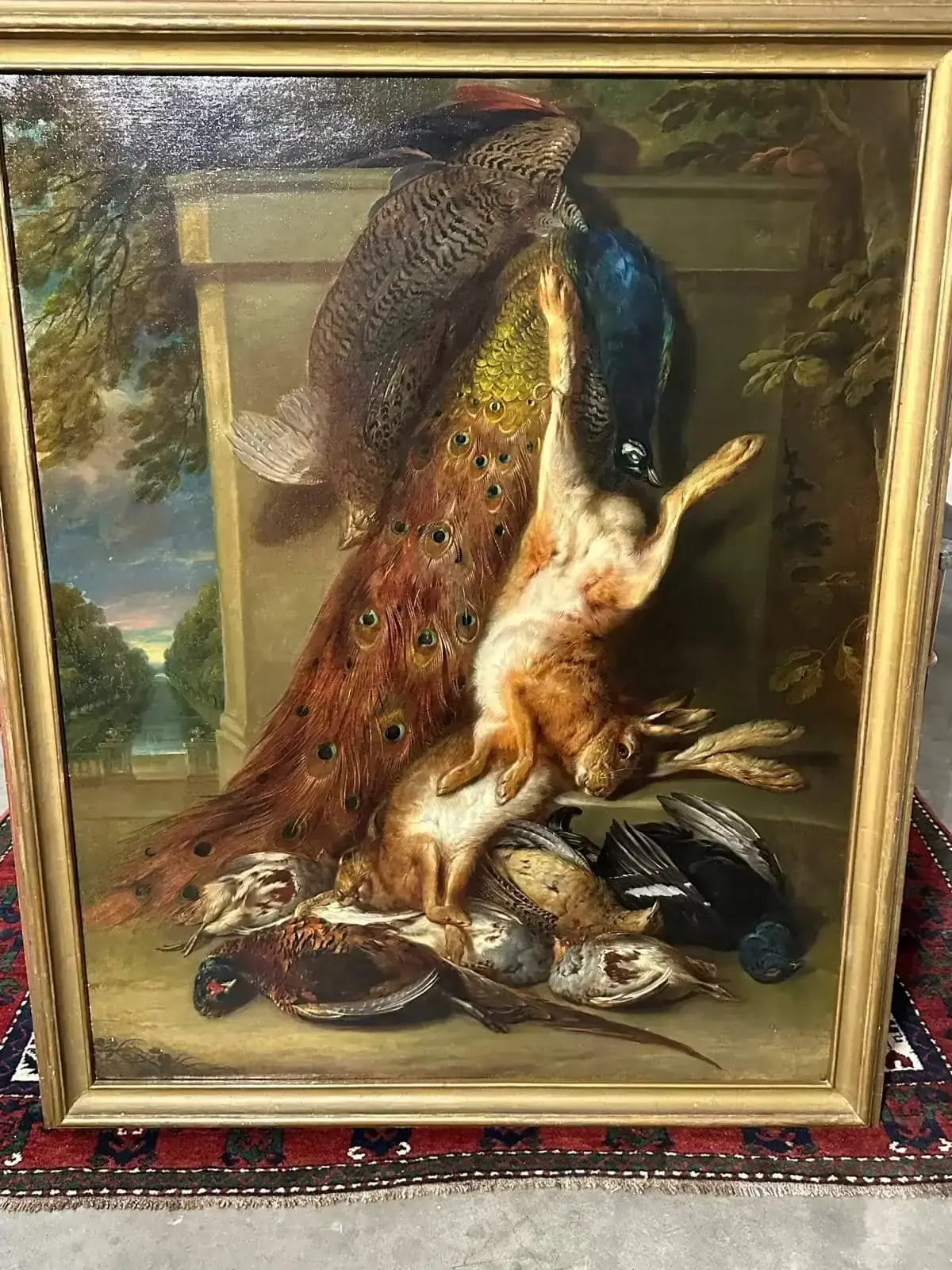 Nature morte avec gibier et paon peint.