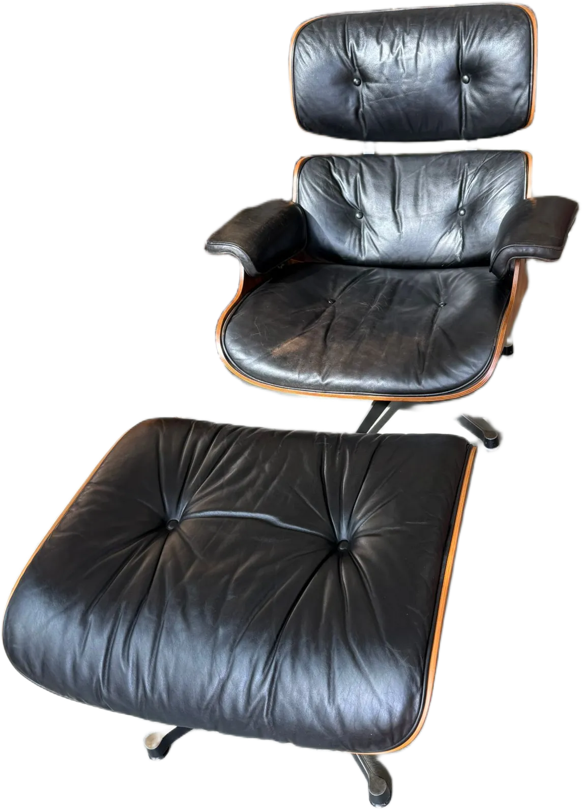 Fauteuil lounge en cuir noir avec repose-pieds
